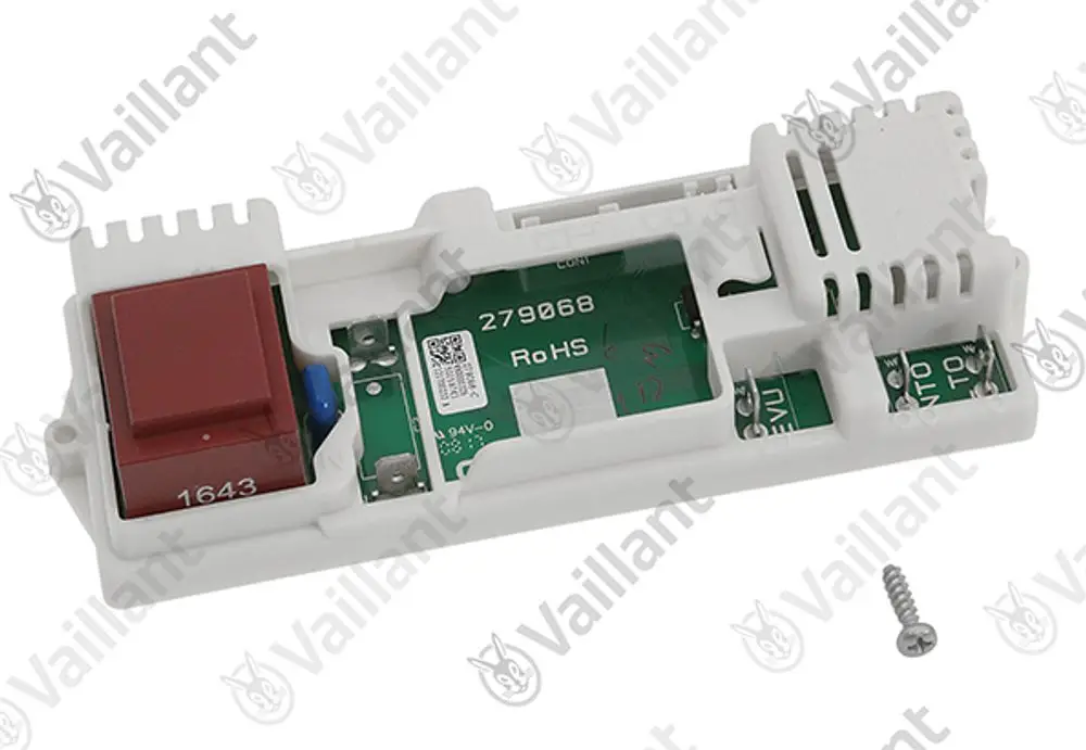 Vaillant Leiterplatte in einem weißen Gehäuse mit einem roten Schalter sowie verschiedenen elektronischen Bauteilen sichtbar. Ein Schraube liegt daneben auf einer neutralen Unterlage.